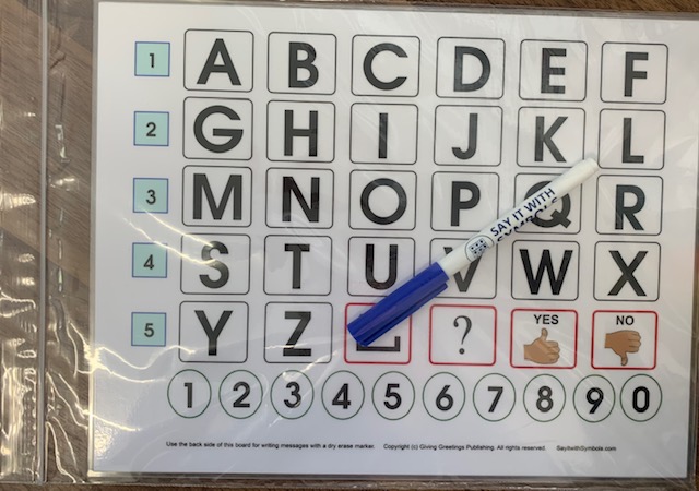 Laminated alphabet letterboard from Say it with Symbols, with a dry-erase pen
